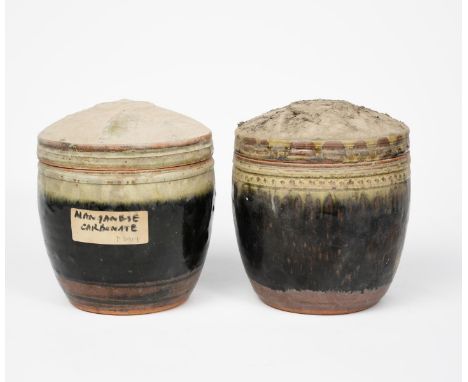 Richard Batterham (1936-2021) a stoneware caddy and cover, covered with an ash glaze over black iron, and another caddy and c