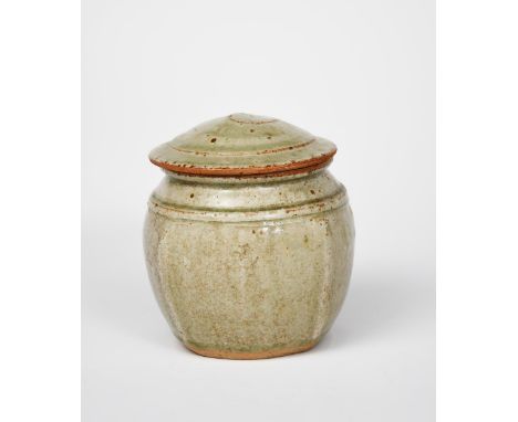 Richard Batterham (1936-2021) a stoneware beaten caddy and cover, covered to the foot with an ash glaze unsigned 14.5cm. high