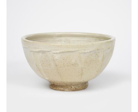 Richard Batterham (1936-2021) a salt-glaze stoneware cut-sided bowl, covered in a pale celadon glaze unsigned 21.5cm. diam. 1