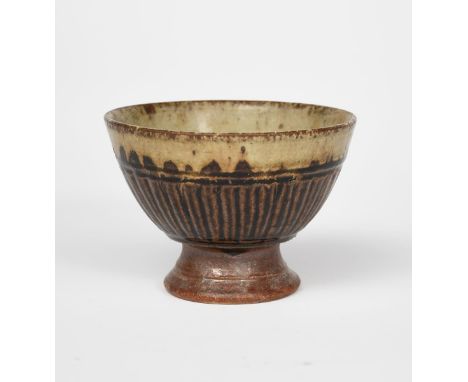 Richard Batterham (1936-2021) a stoneware pedestal bowl with cut flutes, covered in an ash glaze with black iron, unsigned 13