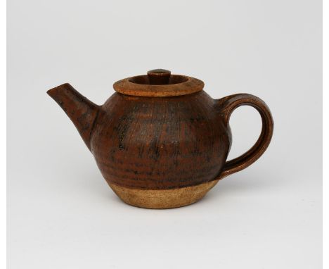 Richard Batterham (1936-2021) an early stoneware teapot, ovoid with vertical cut design, covered to the foot with a black iro