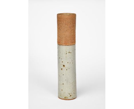 Robin Welch (1936-2019) a tall cylindrical vase, glazed to the lower half with a celadon glaze with iron spots, impressed Rob