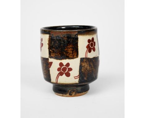 John Maltby (1936-2020) a stoneware unomi, footed form, painted with red flowers on chequered ash and tenmoku ground, impress