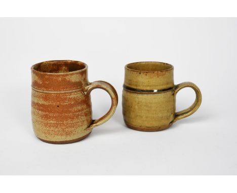 Richard Batterham (1936-2021) a salt-glaze stoneware mug,  and another mug covered in an ash glaze unsigned 10.5cm. high (sal