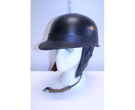 A vintage motor bike helmet (strap needs attention) 