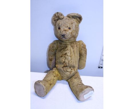 A vintage articulated plush bear. 