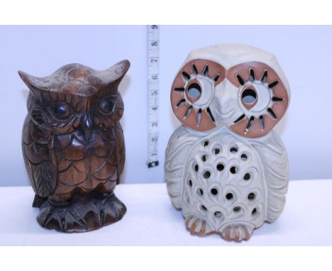 A ceramic owl figure  light and a carved heavy wooden owl figure 