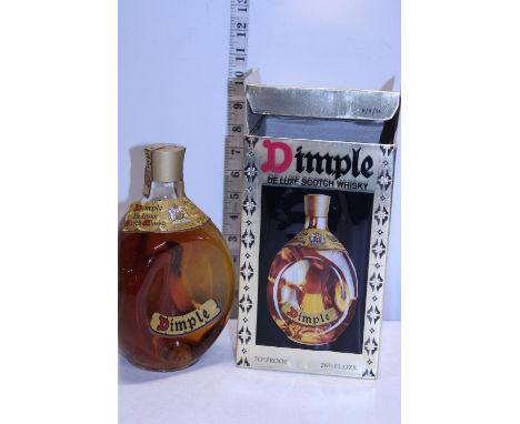 A boxed Dimple scotch whisky 