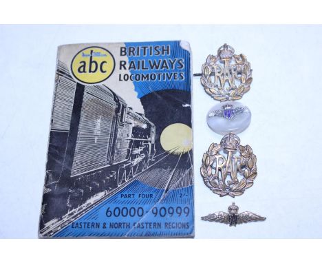 A vintage British Railways Locomotives book and four RAF badges 