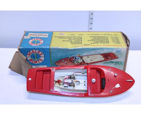 A boxed Scalex speed boat (engine cover missing) 