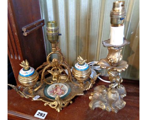 Early 20th century French ormolu and hand painted porcelain inkstand having centre light, with hanging cherub flanked by two 