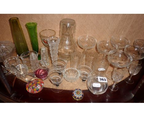 Shelf of vintage drinking glasses including Champagne coupes, paperweights, vases, etc