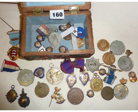 An old box covered with wax letter seals, containing commemorative medals and medallions, enamel badges and studs including s