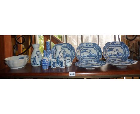 Shelf of assorted Oriental blue and white china vases and dishes inc. Sake bottles and Chinese dishes