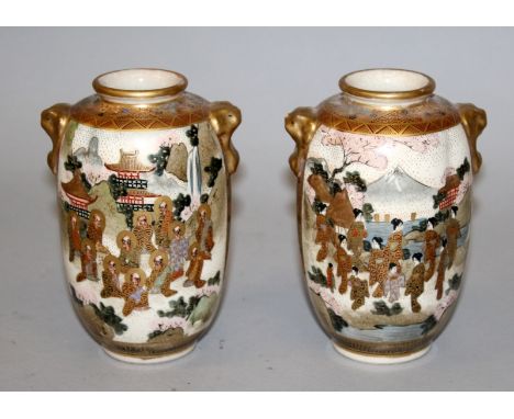 A SMALL PAIR OF EARLY 20TH CENTURY SIGNED JAPANESE SATSUMA EARTHENWARE VASES, the fluted sides painted with a panel of sennin