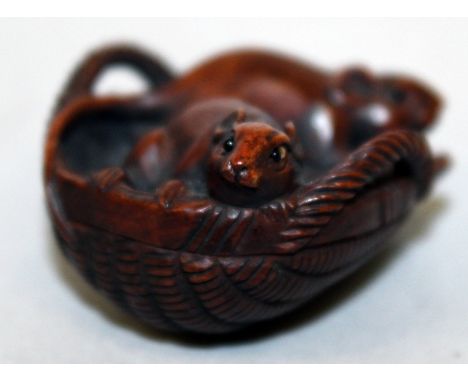 A GOOD QUALITY 19TH CENTURY SIGNED JAPANESE MEIJI PERIOD WOOD NETSUKE, carved in the form of two rats inside a basket of maiz