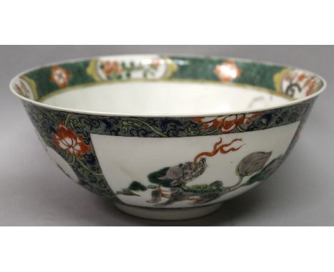 A 19TH/20TH CENTURY CHINESE FAMILLE VERTE PORCELAIN BOWL, the sides painted with a panel of a wave borne carp and a panel of 