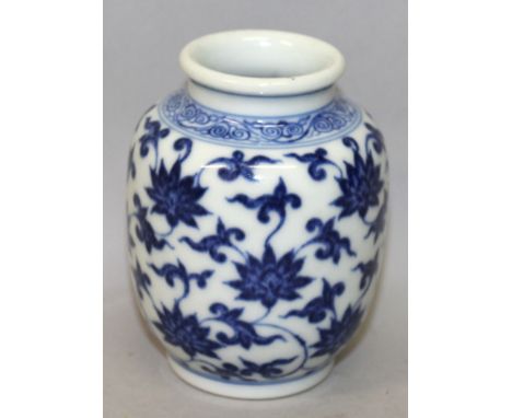 A SMALL CHINESE BLUE & WHITE PORCELAIN VASE, the sides decorated with a formal design of scroll and leaf stemmed lotus, the b