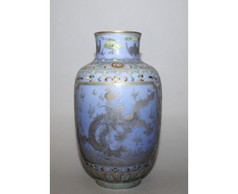 A CHINESE FAMILLE ROSE BLUE GROUND PORCELAIN VASE, decorated with two panels of dragons reserved on a formal foliate ground, 