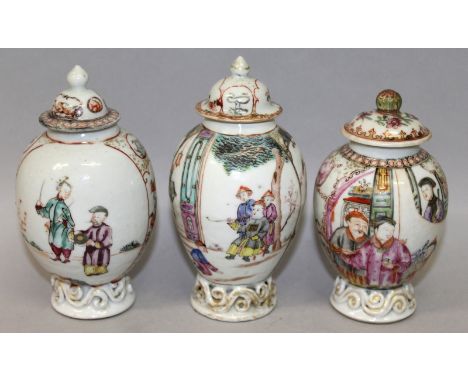 A GROUP OF THREE 18TH CENTURY CHINESE QIANLONG PERIOD FAMILLE ROSE MANDARIN TEA CADDIES, and matching covers, each caddy pain