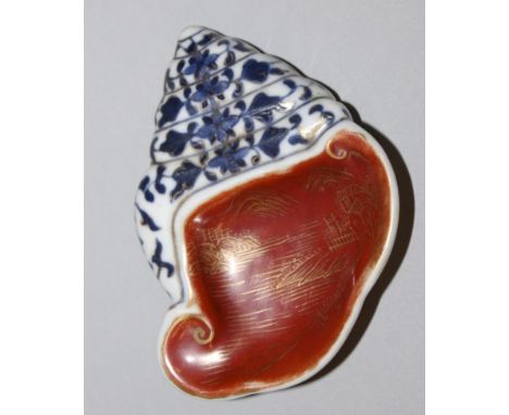 AN UNUSUAL SMALL CHINESE IRON-RED & UNDERGLAZE-BLUE PORCELAIN BRUSHWASHER, moulded in the form of a conch shell, the iron-red