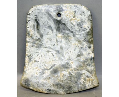 AN INTERESTING CHINESE JADE AXE, possibly Neolithic Period, the predominantly mottled green stone with areas of white patinat