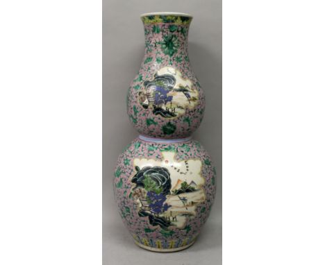 A GOOD LARGE CHINESE PINK GROUND FAMILLE ROSE DOUBLE GOURD PORCELAIN VASE, the sides painted with shaped river landscape pane