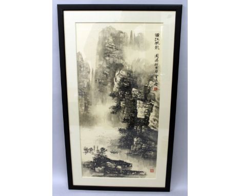 A 20TH CENTURY FRAMED CHINESE PRINT, depicting a mountainous landscape scene, the frame 31.6in x 18.25in.