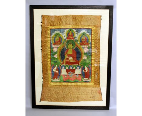 A 20TH CENTURY FRAMED TIBETAN THANGKA, depicting aspects of Buddha, within a patterned silk surround, the frame 38in x 29in.