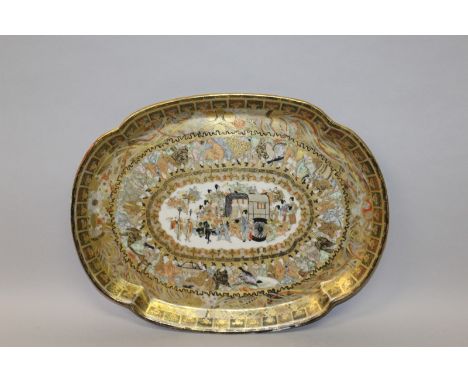A 19TH/20TH CENTURY JAPANESE KUTANI PORCELAIN TRAY, circa 1900, of quatrefoil form, elaborately painted with a central panel 