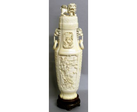 A FINE QUALITY EARLY 20TH CENTURY CHINESE CARVED IVORY VASE &amp; COVER, together with a fitted wire-inlaid wood stand, the s