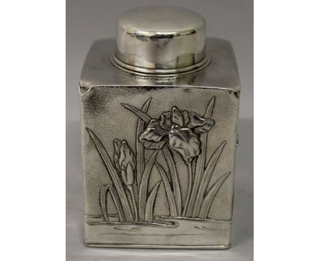 A GOOD QUALITY JAPANESE MEIJI PERIOD EMBOSSED SILVER CADDY WITH LINER &amp; COVER, weighing 230gm, the sides decorated with i