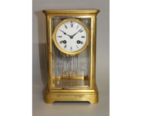 A 19TH CENTURY FRENCH BRASS FOUR GLASS CLOCK with eight day movement.  10ins high.