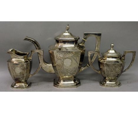 A GOOD EARLY 20TH CENTURY CHINESE SILVER TEA SET, weighing 1.3Kg in total, comprising a teapot with hinged cover, a milk jug 