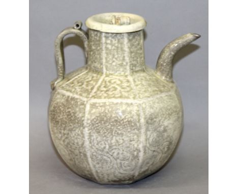 A CHINESE SONG STYLE CELADON PORCELAIN EWER & COVER, of octagonal section, the sides moulded with foliate scroll decoration, 