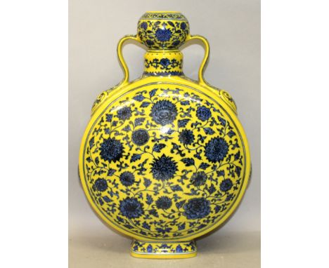 A GOOD QUALITY CHINESE MING STYLE YELLOW GROUND BLUE & WHITE PORCELAIN MOON FLASK, decorated overall with formal designs of s