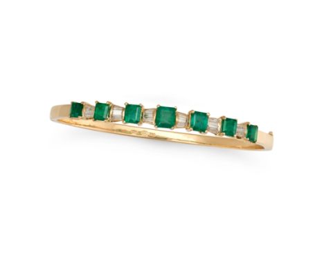 AN EMERALD AND DIAMOND BANGLE the hinged bangle set with a row of square step cut emeralds accented by baguette cut diamonds,