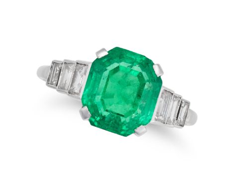 AN EMERALD AND DIAMOND RING set with an octagonal step cut emerald of approximately 4.09 carats, the stepped shoulders set wi