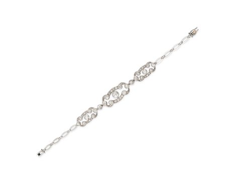 A DIAMOND BRACELET comprising three openwork plaques set throughout with old and rose cut diamonds on a fancy oval link chain