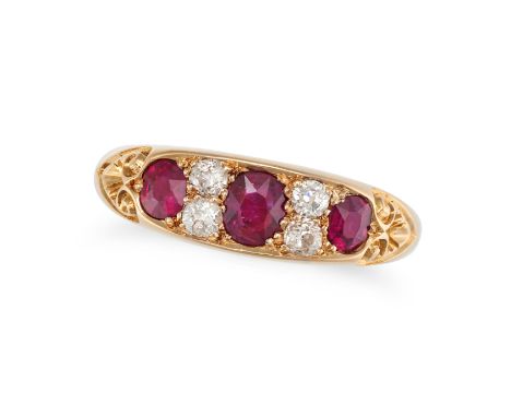 A RUBY AND DIAMOND RING in 18ct yellow gold, set with three cushion cut rubies accented by pairs of old cut diamonds, partial