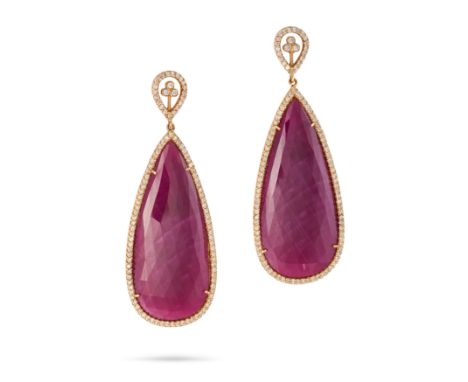 A PAIR OF RUBY AND DIAMOND DROP EARRINGS each comprising a pear shaped stud set with round cut diamonds, suspending a pear sh