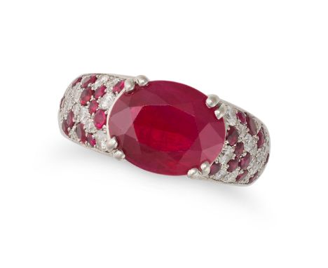 A RUBY AND DIAMOND DRESS RING set with an oval cut ruby of approximately 3.00 carats, the band pave set with round cut diamon