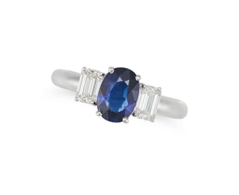 A SAPPHIRE AND DIAMOND THREE STONE RING set with a cushion cut blue sapphire of 1.29 carats, between two emerald cut diamonds