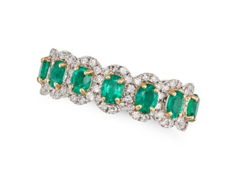 AN EMERALD AND DIAMOND CLUSTER RING in 18ct white gold, set with seven oval cut emeralds in clusters of round cut diamonds, f