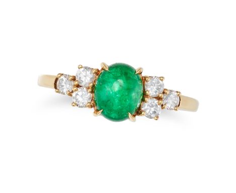 AN EMERALD AND DIAMOND RING in 18ct yellow gold, set with a cabochon emerald between trios of round brilliant cut diamonds, i