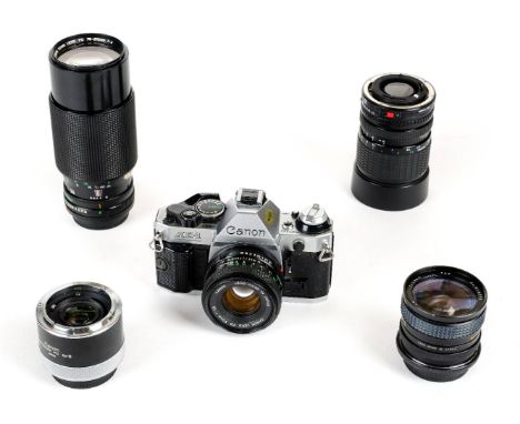 * Canon AE-1 Program camera and lenses. Collection of Canon 35mm camera equipment, including Canon AE-1 Program body (Serial 