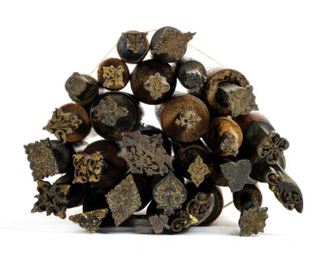 * Decorative finishing tools. 30 decorative brass finishing tools, mostly centre & few corner tools of traditional design, ma