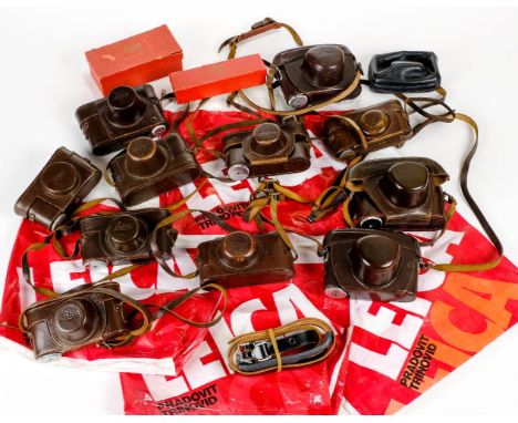 * Leica camera cases. A collection of 11 various Leica Ever Ready leather cases, plus a Leitz lens case, a Leitz compact came