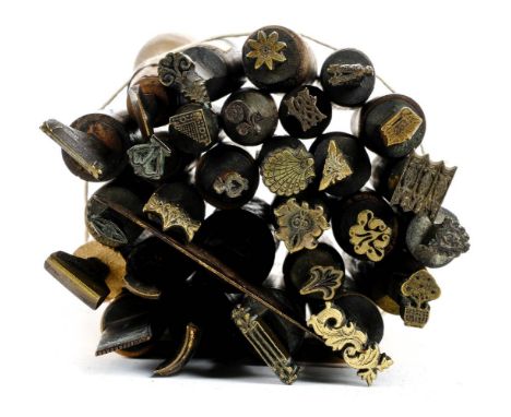 * Decorative finishing tools. A collection of 20 brass decorative finishing tools, comprising mostly centre and few corner to