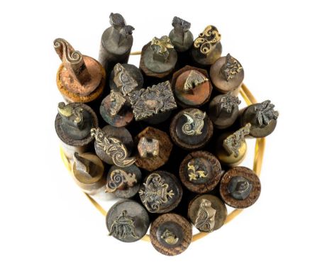 * Decorative finishing tools. A collection of 25 brass decorative finishing tools, comprising mostly centre and few corner to